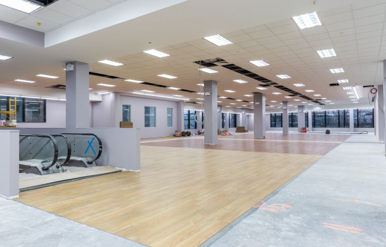 Modell's has already began building out its space with wooden floors.