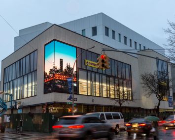 The exterior of 1601 Kings Highway in Sheepshead Bay features a two-sided video screen.
