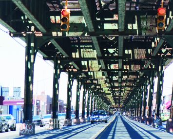 Jerome Avenue beneath the elevated 4 tracks in the Bronx.