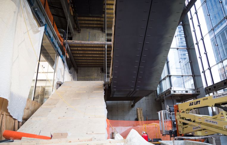 Escalators on the lobby led to the transportation hub underground.