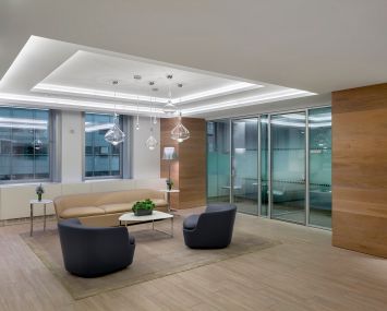 The seating area on the 11th floor features residential amenities, such as wood flooring, carpeting and more relaxed seating.