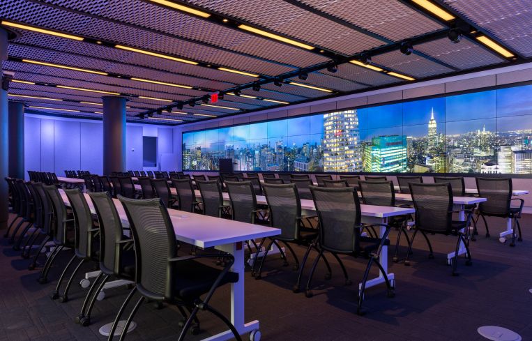 The largest conference room on the Convene/Well & amenity floor at 4 Times Square features a gigantic customizable video screen, and seating for nearly 100.