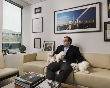 Michael DeMarco (and his four teacup Maltese dogs) in his office at Mack-Cali's Jersey City headquarters.