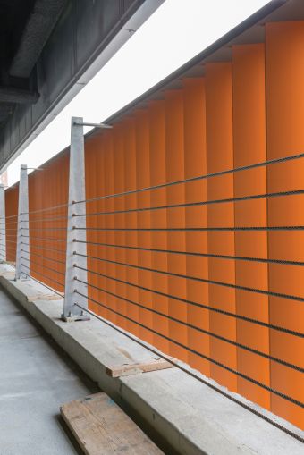 The brick colored aluminum panels on the second floor parking garage of 626 Sheepshead Bay Road not only hide cars from public view, but their color mimics the look and feel of other brick buildings in the neighborhood.