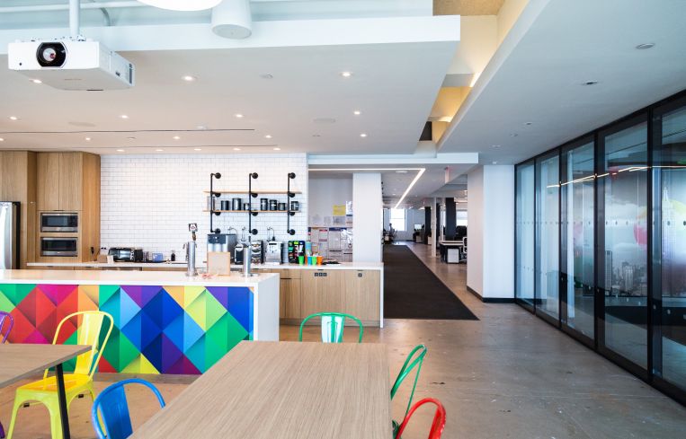 Agoda's offices have a massive pantry with colorful chairs and beer on tap.