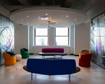 Relaxed seating can be found all over the office, as well as images of popular New York City places.