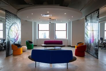 Relaxed seating can be found all over the office, as well as images of popular New York City places.
