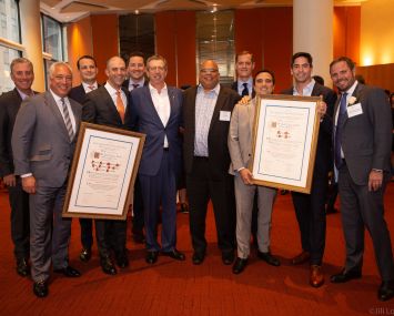 From left: Bob Gibson and Patrick Smith, JLL; Benjamin Birnbaum and Ben Shapiro, Newmark Knight Frank; Matthew Ogle, JLL; Bill Rudin, REBNY Chairman; John H. Banks, REBNY President; Corey Zolcinski, JLL; Neil Seth and Kenji Ota, Cushman & Wakefield; Steven Soutendijk, Cushman & Wakefield, Co-Chair of REBNY’s Retail Committee.