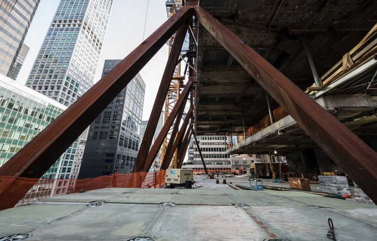 The new steel columns were added to the building as the old was being completed.