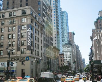 349 Fifth Avenue, left, when WeWork was a tenant. The coworking giant closed the location in 2021.