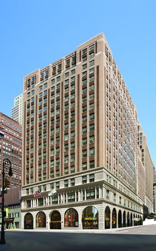 The 18-story street corner building at 501 Seventh Avenue.