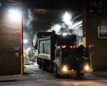 A commercial trash truck leaves a waste transfer station in Bushwick.
