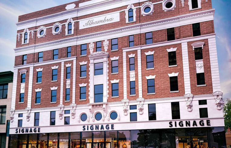 A large red and white building in Harlem.