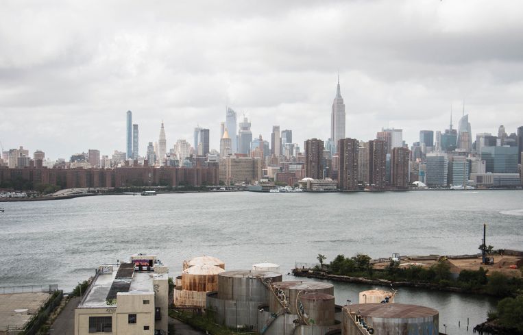 The view of the East River from the roof deck of 25 Kent.