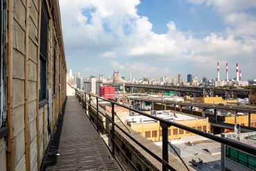 Normandy Real Estate Partners is converting a warehouse at 43-10 23rd Street  into creative office space. The future roof deck has views of the Queensboro Bridge, looking out over Long Island City's industrial zone.