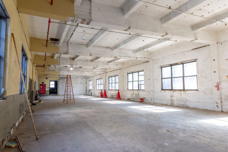 The top floor of 43-10 23rd Street in Long Island City, features high ceiling heights and multiple windows.