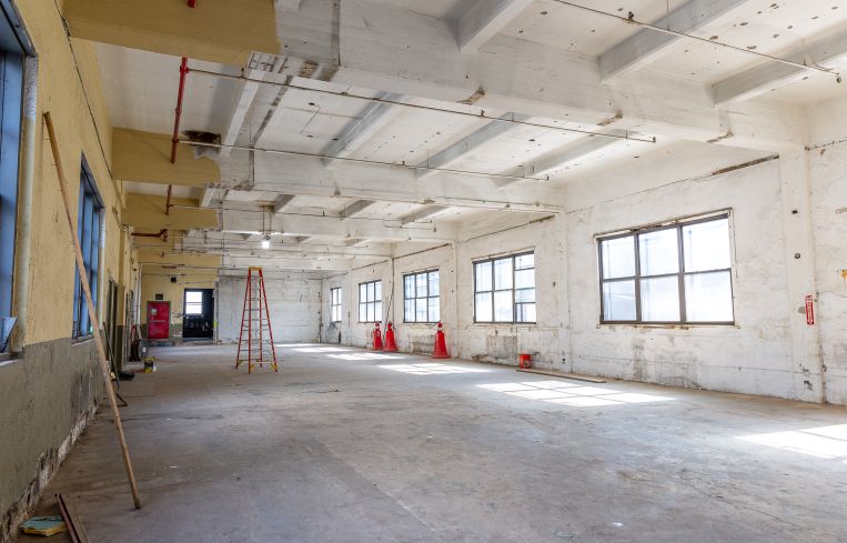 The top floor of 43-10 23rd Street in Long Island City, features high ceiling heights and multiple windows.