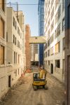 The alleyways between the buildings at 'The Hall' will eventually become landscaped common areas with seating and space for events.