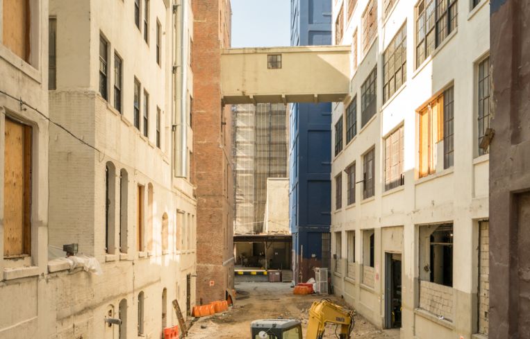 The alleyways between the buildings at 'The Hall' will eventually become landscaped common areas with seating and space for events.