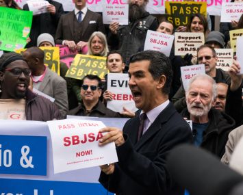 Councilman Ydanis Rodriguez, one of the sponsors of the Small Business Jobs Services Act, speaks at a rally for the bill before a council hearing.