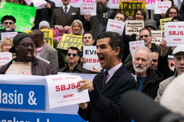 Councilman Ydanis Rodriguez, one of the sponsors of the Small Business Jobs Services Act,  speaks at a rally for the bill before a council hearing.