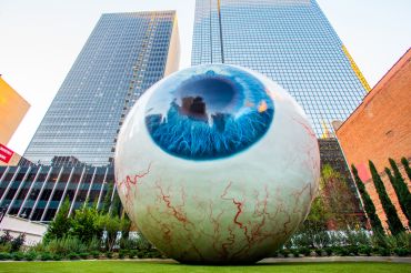 The Eye at The Joule Hotel, a 30-foot-tall art exhibit designed by Tony Tasset that was added to the grounds of the hotel on Main Street in Downtown Dallas in 2009, a year after its opening.