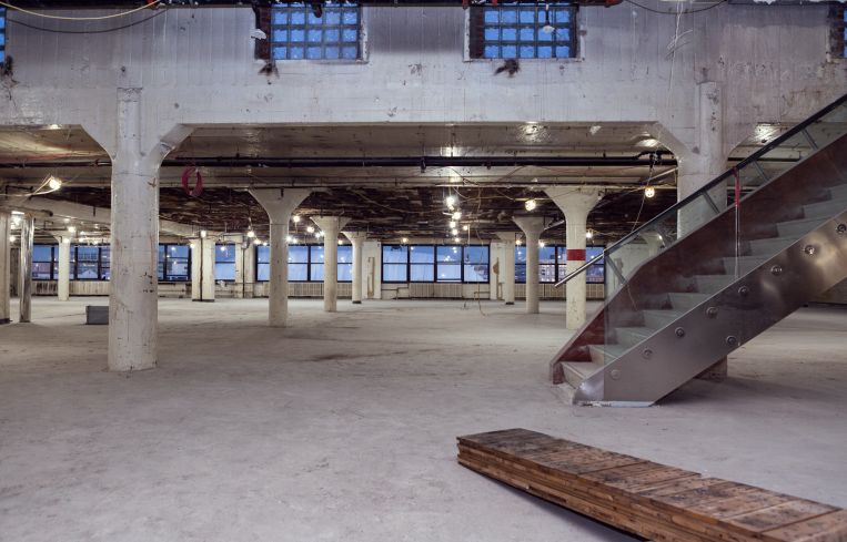 The huge, partially vacant top floor also has a 3,000-square-foot penthouse, accessed via the stairs on the right.