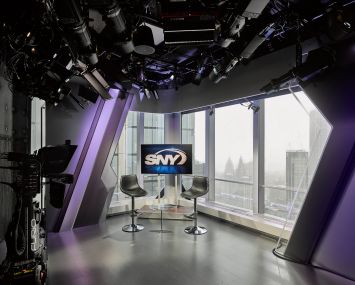 SportsNet New York's new studios in 4 World Trade Center feature floor to ceiling windows and accent lighting.