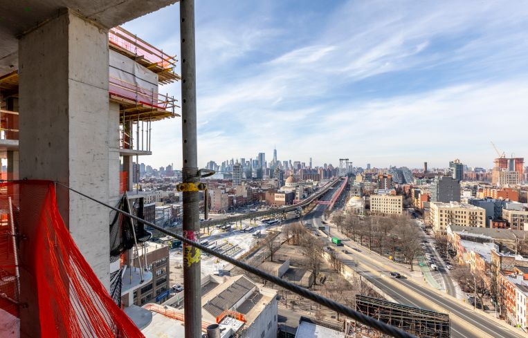The east-facing view from the 16th floor of the residential tower in the Dime Savings Bank complex features views of the Williamsburg Bridge and neighboring Manhattan.