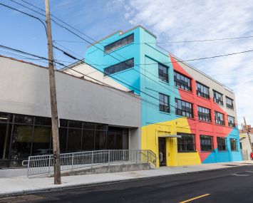 The exterior of The Breeze was painted in bright primary colors in an effort to connect with the surrounding murals and graffiti in East Williamsburg.