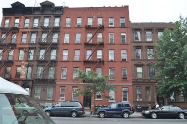 312 East 116th Street, one of the properties co-owned by Amit Doshi and Michael Besen.