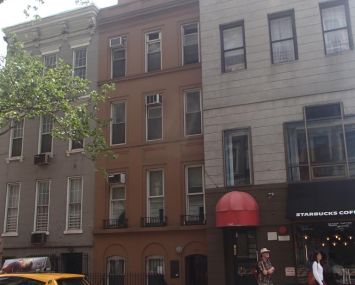 A shot of the current building at 148 East 78th Street, pre-development.