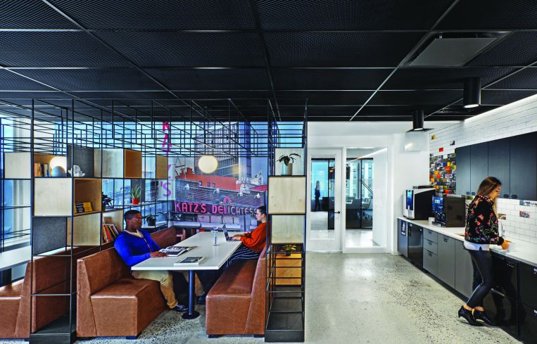 The cafeteria also has booths with aged leather seats, steel shelving and a large photo of Katz's deli on the Lower East Side.