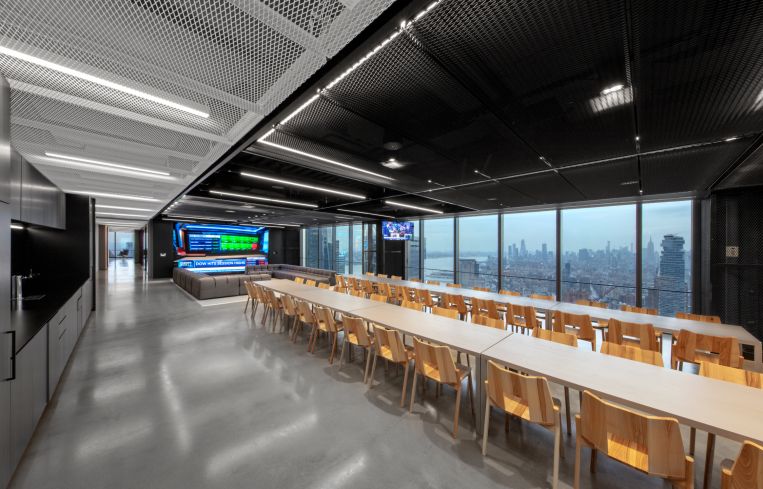 A long table set up for a company town hall.
