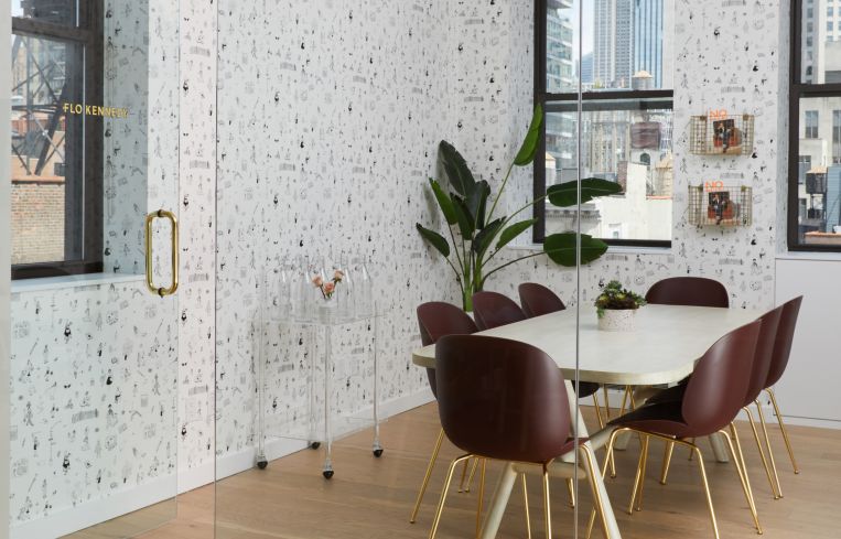 The new conference room features a custom-designed wallpaper with women doing different activities in New York City.