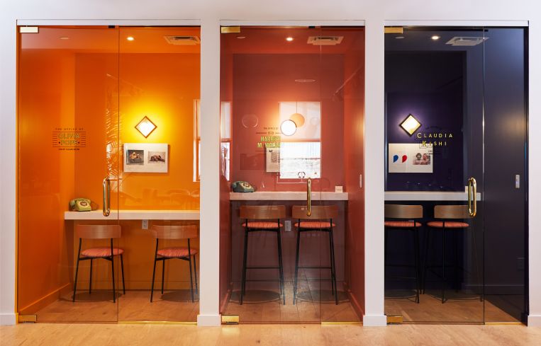 Yellow, rust, and purple walls for the new phone booths, which are named after fictional women.