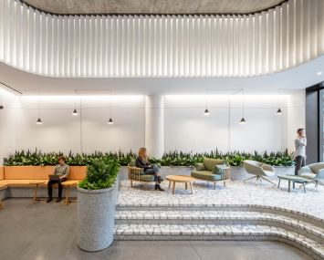 A+I worked on the renovation of three lobbies in former Hudson Square printing press buildings. At 225 Varick, the team added a raised seating area and vertical fins to highlight the 14-foot-tall ceilings.