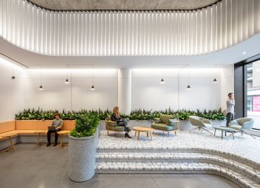 A+I worked on the renovation of three lobbies in former Hudson Square printing press buildings. At 225 Varick, the team added a raised seating area and vertical fins to highlight the 14-foot-tall ceilings. 
