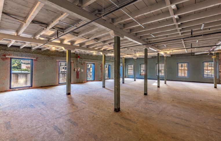 Part of the former Watchtower campus includes 55 Furman Street, a short Civil War-era brick-and-beam warehouse.