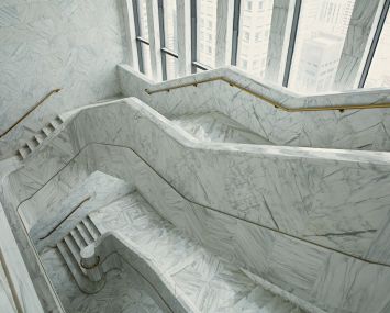 The executive floors at 550 Madison have a massive white marble staircase that links all three floors.