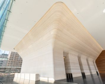 The lobby at One Manhattan West is cantilevered over the Amtrak tracks near Penn Station, which were decked over as part of the development.