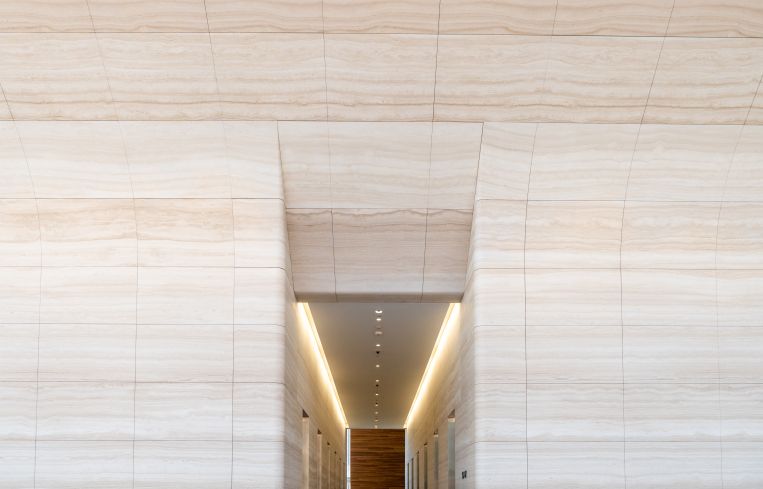 A special computerized milling machine was used to create the curved walls and ensure that the veins in the marble lined up.