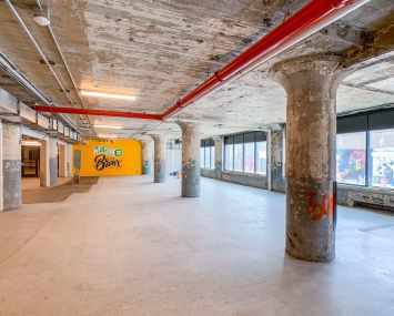 Union Crossing, former warehouse in the South Bronx, has been renovated with new mechanicals, new elevators, new bathrooms and a new lobby that includes a bright mural.
