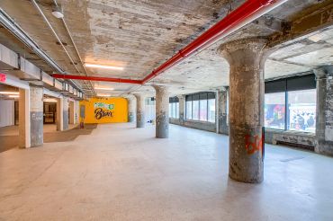 Union Crossing, former warehouse in the South Bronx, has been renovated with new mechanicals, new elevators, new bathrooms and a new lobby that includes a bright mural.