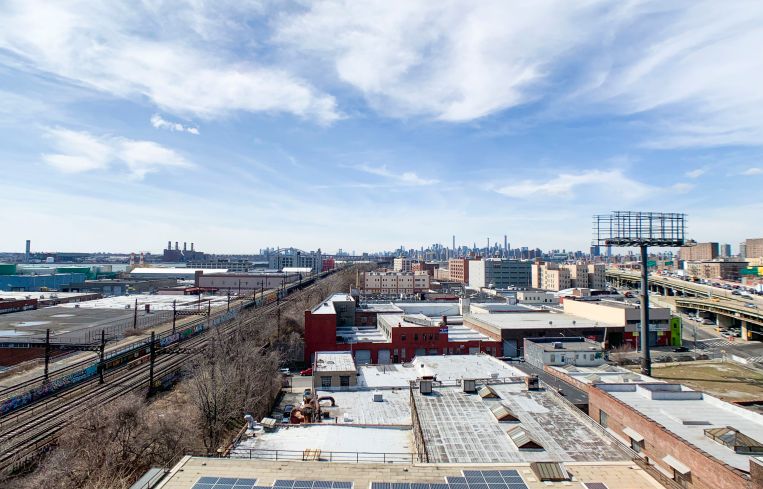 Views from the roof of Union Crossing, which faces elevated freight tracks and the Bruckner Expressway.