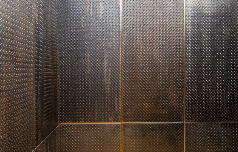The new elevators feature aged metal siding, wooden floors and lit up ceilings.