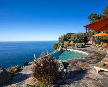 An infinity edge pool and the view from the resort.
