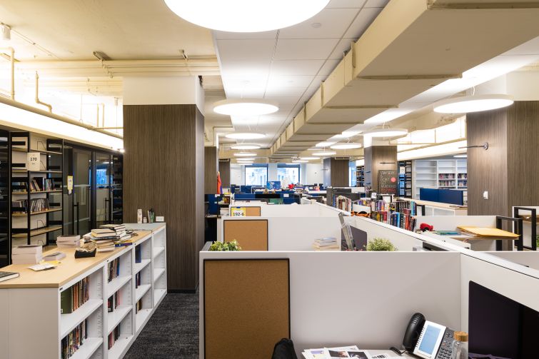 Each imprint has offices designed with a slightly different look, but they all feature neutral tones and alternate cubicles with closed offices. 