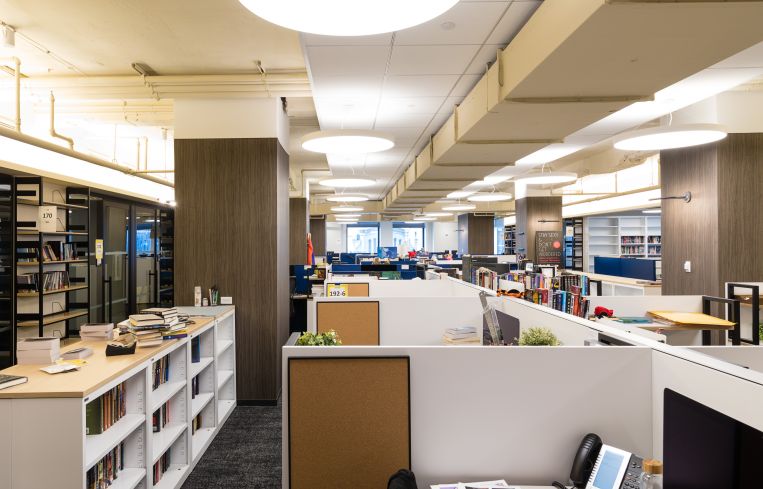 Each imprint has offices designed with a slightly different look, but they all feature neutral tones and alternate cubicles with closed offices.