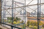 Views through the scaffolding of Pier 40, the Hudson River and New Jersey. 